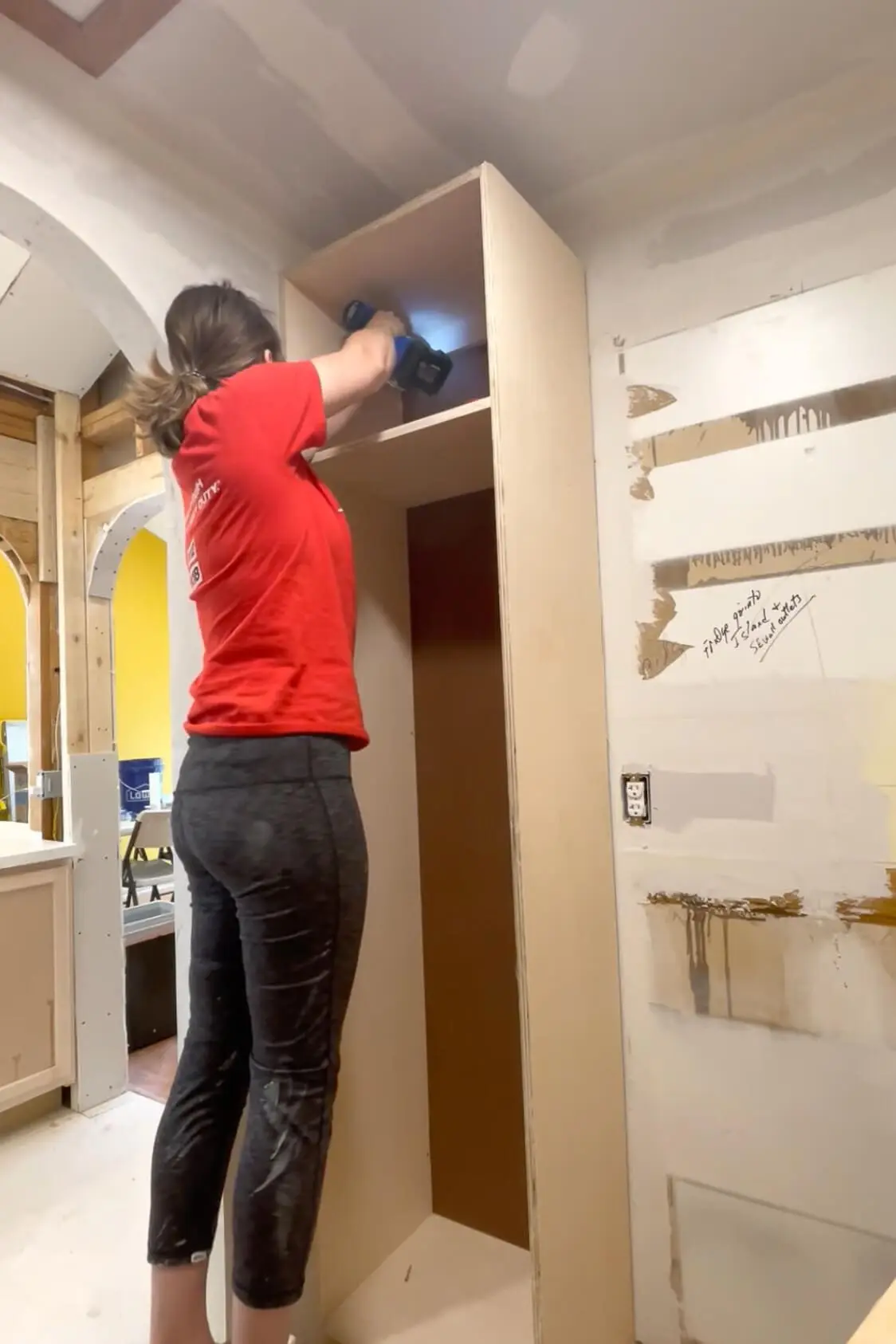 Installing a pantry shelf.